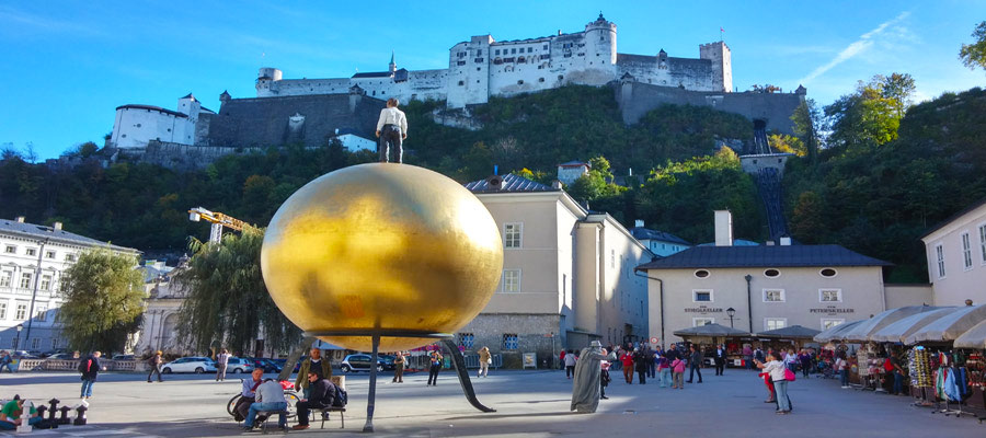 Locals play chess below Salzburg's medieval fortress